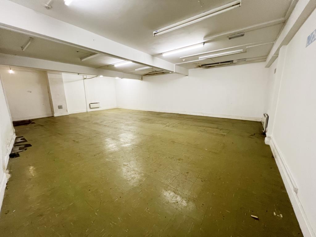 Lot: 67 - SUBSTANTIAL RESIDENTIAL DEVELOPMENT WITH OUTSTANDING VIEWS PLANNING FOR TWELVE APARTMENTS - Storage room to the rear of 5 Montpellier Road